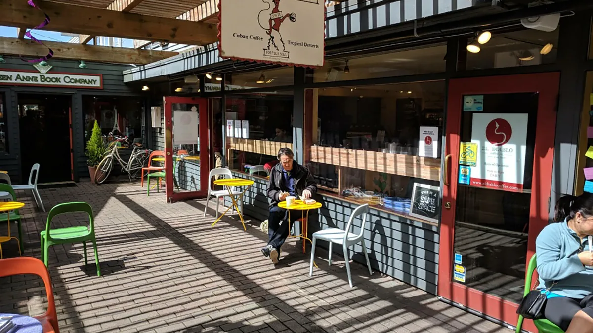 The outdoor seating area and storefront of El Diablo Coffee Company in Seattle.