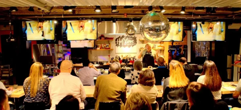 Guests watching a cooking demonstration at Hot Stove Society in Seattle.