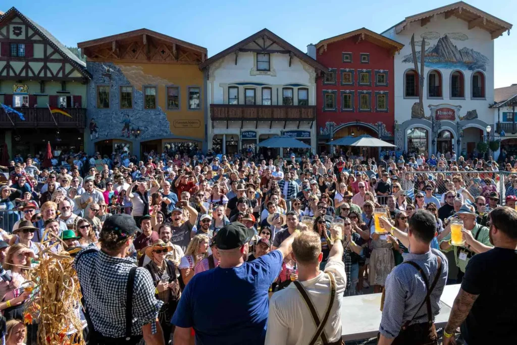 A large crowd celebrating Oktoberfest in downtown Leavenworth, Washington.