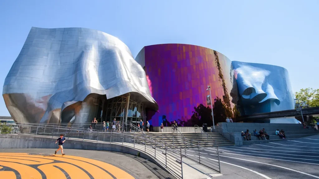 Museum of Pop Culture colorful curved exterior beneath a clear Seattle sky.