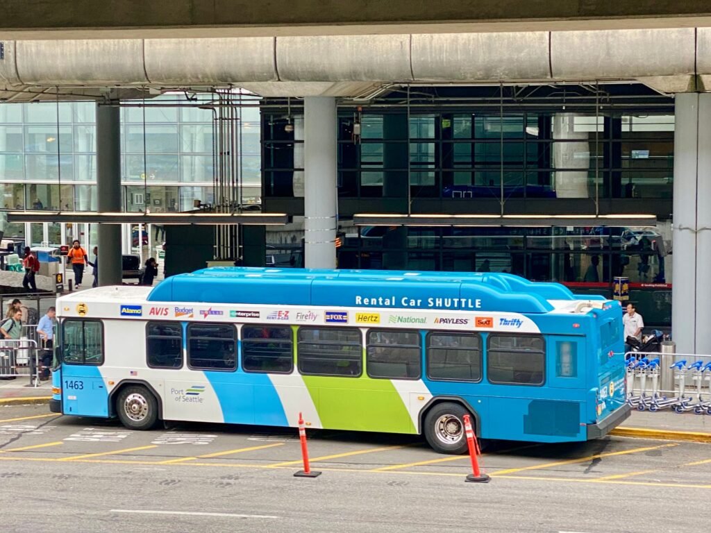 Seattle Airport to Downtown by rental car.  Shuttle takes customers to the rental car terminal.