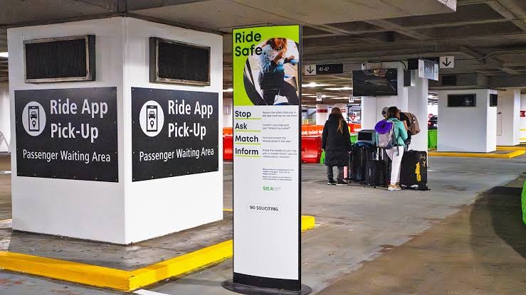 SeaTac Airport to Downtown Seattle by Uber and Lyft.  Photo shows the ridesharing terminals at level 3 of SeaTac Airport parking.